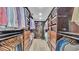 Expansive walk-in closet with custom shelving and storage for clothing and accessories at 59 Jimmy Lee Rd, Winter Haven, FL 33880