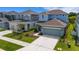 This aerial captures a well-maintained lawn and a gray two-story home at 6261 Great Bear Dr, Lakeland, FL 33805