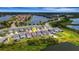 Aerial view showcases a lakeside neighborhood with well-maintained houses and green lawns at 6261 Great Bear Dr, Lakeland, FL 33805
