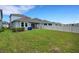 The spacious backyard boasts a white fence and is perfect for outdoor gatherings at 6261 Great Bear Dr, Lakeland, FL 33805