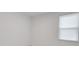 Bright, empty bedroom with light filtering blinds on the window at 6261 Great Bear Dr, Lakeland, FL 33805