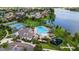 Aerial view of community center featuring pool, tennis courts, playground, and clubhouse at 6261 Great Bear Dr, Lakeland, FL 33805