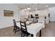 Open dining area flows into a modern kitchen with stainless appliances at 6261 Great Bear Dr, Lakeland, FL 33805