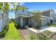 Charming two-story home with a well-manicured lawn, inviting entrance and attached garage at 6261 Great Bear Dr, Lakeland, FL 33805