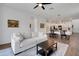 Open-concept living space with view into kitchen and dining area at 6261 Great Bear Dr, Lakeland, FL 33805