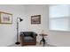 Living Room featuring a gray armchair, side table, and window at 6261 Great Bear Dr, Lakeland, FL 33805