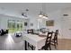 Open-plan living space with dining area and access to the backyard at 6261 Great Bear Dr, Lakeland, FL 33805