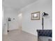 Loft area with black floor lamp and framed artwork hanging on the wall at 6261 Great Bear Dr, Lakeland, FL 33805