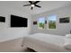 The main bedroom has carpet, a ceiling fan, two windows, and plenty of wall space at 6261 Great Bear Dr, Lakeland, FL 33805