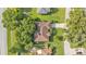 Aerial view of a well maintained single story home with mature landscaping and a long driveway at 633 Hart Lake Dr, Winter Haven, FL 33884