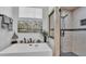 Modern bathroom featuring a soaking tub, walk-in shower, and stylish decor at 633 Hart Lake Dr, Winter Haven, FL 33884