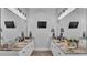Dual-sink bathroom with granite countertops, modern fixtures, and well-lit vanity mirrors at 633 Hart Lake Dr, Winter Haven, FL 33884