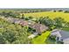 Aerial view of a lovely single Gathering home featuring a well-manicured lawn and mature trees at 633 Hart Lake Dr, Winter Haven, FL 33884