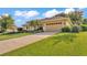 Charming home featuring mature landscaping, a long driveway, and a spacious two-car garage at 633 Hart Lake Dr, Winter Haven, FL 33884