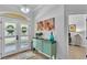 Welcoming foyer with neutral paint, wood floors, stylish furnishings and plenty of natural light at 633 Hart Lake Dr, Winter Haven, FL 33884
