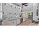 Modern kitchen with white cabinets, granite countertops, stainless steel appliances, and an adjacent breakfast nook at 633 Hart Lake Dr, Winter Haven, FL 33884