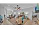 Bright and open living room with neutral colors, a ceiling fan, and plenty of space to relax at 633 Hart Lake Dr, Winter Haven, FL 33884