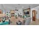 Open-concept living room with a fireplace, high ceilings, neutral colors, and plenty of seating at 633 Hart Lake Dr, Winter Haven, FL 33884