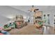 Comfortable living room with a fireplace, neutral colors, wood floors, and plenty of seating at 633 Hart Lake Dr, Winter Haven, FL 33884