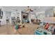 Bright and open living room with a fireplace, high ceilings, wood floors, and comfortable seating at 633 Hart Lake Dr, Winter Haven, FL 33884