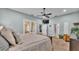 Comfortable main bedroom with a sliding glass door, a ceiling fan, and access to an outdoor area at 633 Hart Lake Dr, Winter Haven, FL 33884