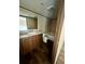 Bathroom featuring a tub, toilet, wood-look floors, and vanity with stone countertop at 711 Whispering Pines Dr, Auburndale, FL 33823