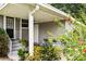 Back porch with an outdoor dining set and a view of the landscaped yard at 819 Glendale St, Lakeland, FL 33803