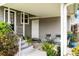 Cozy back porch with outdoor seating and garden views at 819 Glendale St, Lakeland, FL 33803
