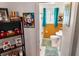 Bathroom featuring wood paneling, a pedestal sink, a window with natural light, and mermaid-themed shower curtain at 819 Glendale St, Lakeland, FL 33803
