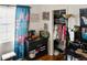 Bedroom featuring a window with patterned curtains, closet, and vanity at 819 Glendale St, Lakeland, FL 33803