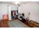 Simple bedroom with hardwood floors, an open closet, and minimalist decor, offering a cozy living space at 819 Glendale St, Lakeland, FL 33803