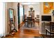 Dining room with hardwood floors, wooden furniture, and colorful art, offering a stylish dining space at 819 Glendale St, Lakeland, FL 33803