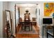 Traditional dining room with wood table, chairs, and colorful decor for a warm and inviting ambiance at 819 Glendale St, Lakeland, FL 33803