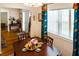 Cozy dining room with hardwood floors and large windows at 819 Glendale St, Lakeland, FL 33803