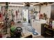 The well-organized garage includes a lawn mower, tools, shelving, washer, and dryer for convenience at 819 Glendale St, Lakeland, FL 33803
