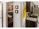 Hallway leading to the kitchen, showcasing its dark cabinets and stainless steel appliances at 819 Glendale St, Lakeland, FL 33803