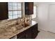 Bright kitchen features granite countertops and stainless steel sink at 819 Glendale St, Lakeland, FL 33803