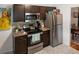 Well-appointed kitchen with stainless steel appliances and patterned flooring at 819 Glendale St, Lakeland, FL 33803