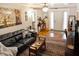 Comfortable living room featuring hardwood floors, a ceiling fan, and stylish decor at 819 Glendale St, Lakeland, FL 33803