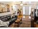 Comfortable living room featuring hardwood floors, a ceiling fan, and stylish decor at 819 Glendale St, Lakeland, FL 33803