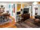 Inviting living room with hardwood floors seamlessly transitioning to a dining area at 819 Glendale St, Lakeland, FL 33803