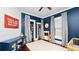 Blue Bedroom with a crib, a play kitchen, and a blue console provides ample storage at 918 South Blvd, Lakeland, FL 33803