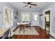 Charming dining room featuring hardwood floors, a modern ceiling fan, and natural light at 918 South Blvd, Lakeland, FL 33803