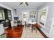 Comfortable dining room with a round table, complemented by a workspace and natural lighting at 918 South Blvd, Lakeland, FL 33803