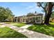 Street view showcasing the home's covered front porch and proximity to neighboring properties at 918 South Blvd, Lakeland, FL 33803