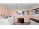 Bright laundry room with modern washer and dryer, a small table, and great natural lighting at 918 South Blvd, Lakeland, FL 33803