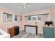 This laundry room includes a table, a floral wall hanging, and ample natural light at 918 South Blvd, Lakeland, FL 33803