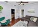 Inviting living room featuring hardwood floors, a sectional sofa, and views into adjacent rooms at 918 South Blvd, Lakeland, FL 33803