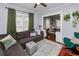 Inviting living room with a sectional sofa, area rug, and open access to the dining area at 918 South Blvd, Lakeland, FL 33803