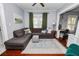 Comfortable living room featuring a plush sectional sofa, area rug, and decorative pillows at 918 South Blvd, Lakeland, FL 33803